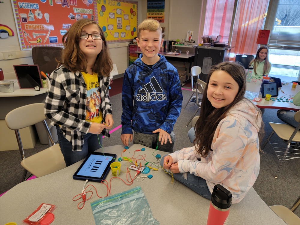 Kids in steam working with technology