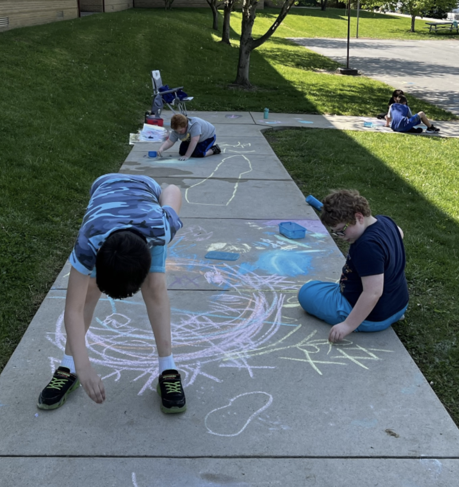 Kids drawing with chalk