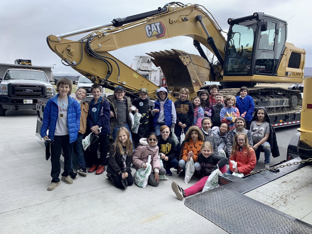 Students in front of a CAT digger